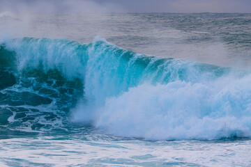 Wave star breaking into foam on the shore.