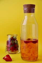 Fototapeta na wymiar bottle of wine and glass with strawberry