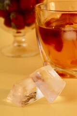 ice and glass of red wine with berries