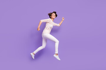 Fototapeta na wymiar Full body profile portrait of cheerful charming girl running look camera isolated on purple color background