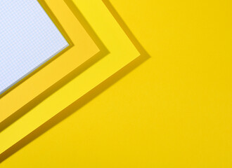 modern yellow bright background with sheets of paper with shadow. Template for business