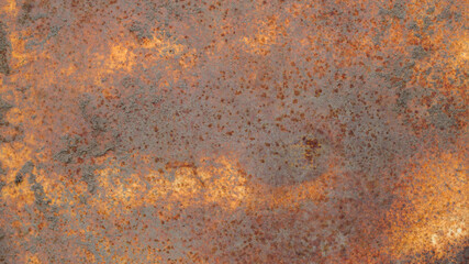The texture of a rusty metal surface covered with dirt and multicolored rust.