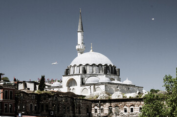 Obraz premium Istanbul Mosque and flying airplane - stock photo