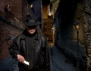 man in dark alley pulls a knife