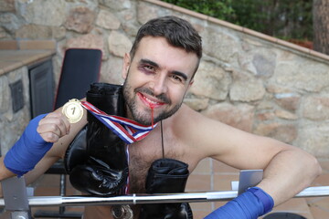 Black eyed man winning a boxing competition