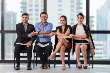 Group of businessman and businesswoman holding hand together, Power of cooperation, Success teamwork concept