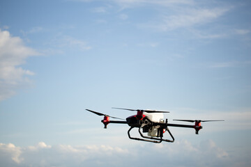 Fototapeta na wymiar Agriculture drone on the green tea field