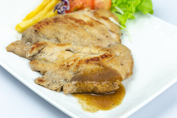 Steak and salad on the white background. New normal since delivery to home food style packing by the plastic tray or foam. Keto food for health. close up photography of isolated background.
