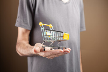 a man holding a small basket