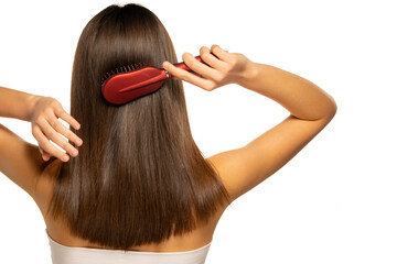 Fototapeta premium woman brushing her hair