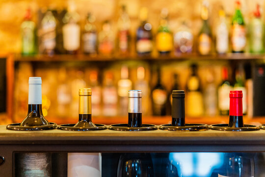 Bottles of wine placed on counter in bar