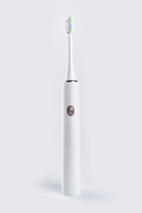 Smart electric toothbrush. Modern technology for health. Healthy teeth. Dentistry. Concept of professional oral care and healthy teeth by using ultrasonic smart toothbrush. 