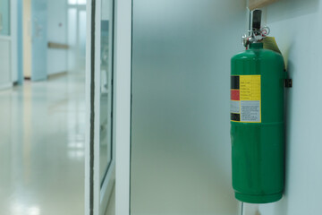 Fire extinguisher in the operating department . Install a fire extinguisher on the wall in...