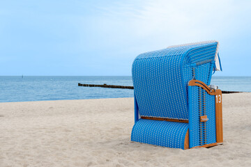 beautiful beach chair in the sand on a sunny, relaxed day on the coast of Mecklenburg Western Pomerania, East Germany
