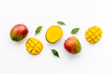 Layout of mango and leaves. Tropical fruits background