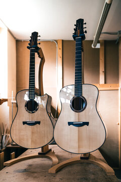 Acoustic guitars against manual instruments in workshop