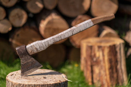 Photography on theme big steel axe with wooden handle