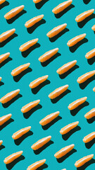 Minimalistic fruit summer pattern idea, fresh organic orange slices on bright blue background. Minimalistic flat lay vertical arrangement, healthy food concept.