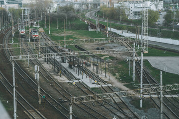 Railway junction with many train tracks near railway station in city