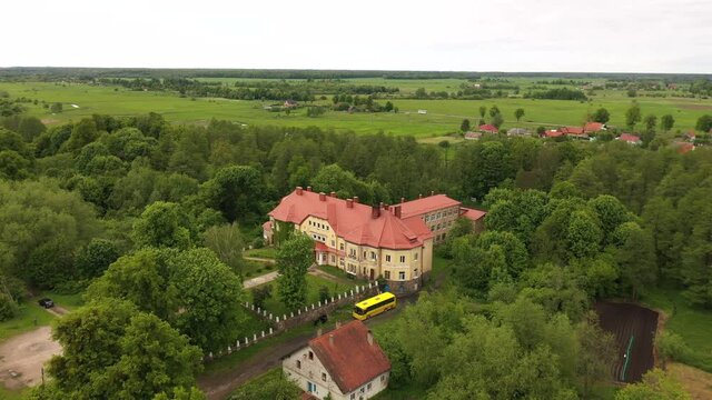 Secondary school in the village of Saranskoye, Kaliningrad region, in the past there was Lauken castle in East Prussia, view from a drone