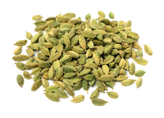 Green cardamom pods on white background