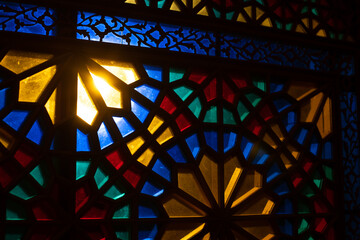 Photo of colored stained glass with colored light