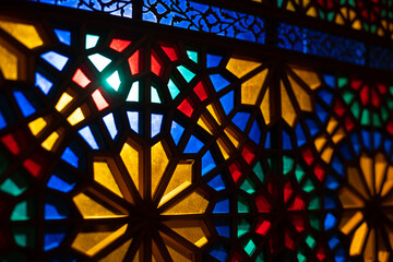 Photo of colored stained glass with colored light