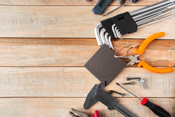 Set of work tools on a wooden background. Festive greeting card concept for Father's day.