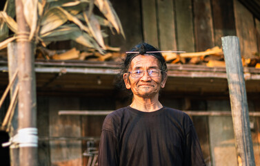 apatani tribal men facial expression with his traditional hair style and blurred background