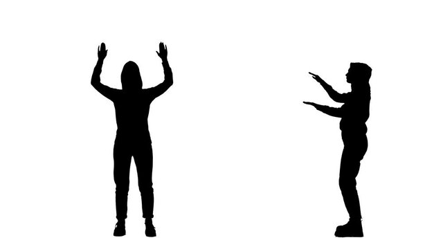 Black silhouette of a young woman in youth stylish clothes dancing a modern dance in a disco. 2 in 1 Collage Front and side view full length on white background. Slow motion ready 59.94fps.