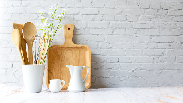 Kitchen tools and kitchenware utensil object on kitchen shelf wood white for healthy eat and health care life.  Wall white brick background, copy space for text