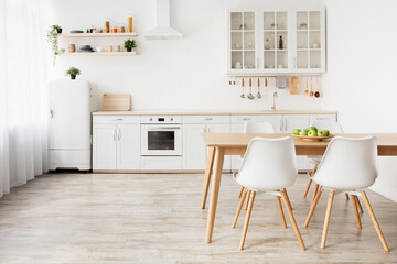 Home nordic interior. Idea of light scandinavian kitchen interior with white and wooden dining furniture, empty space