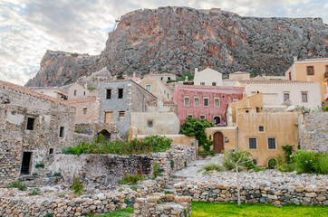 Fototapeta na wymiar Medieval City of Monemvasia with Amphitheatrical Architecture. Historic Old Castle Town with Multicolored Houses Built on a Huge Rock. Monemvasia Island, Greece
