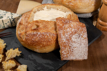 Cream cheese inside Italian bread with croutons, fondue.
