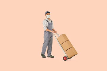 Delivery man and hand truck trolley style with brown cardboard colorful background.