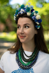 Brunette with a luxurious wreath, white T-shirts, and satiety.