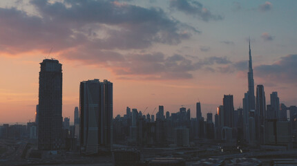 AERIAL. Top view of downtown Dubai at beautiful sunset, United Arab Emirates.