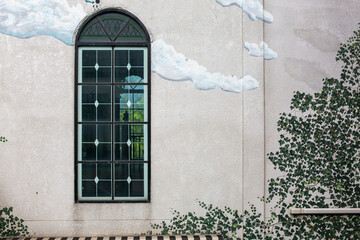 window in a wall and printing on wall