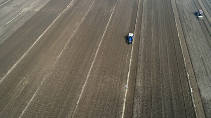 Farmers drive tractors to level up land, North China