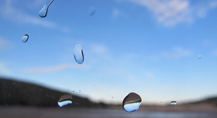 Summer sky at the beach with  defocused back ground and water droplets in focus