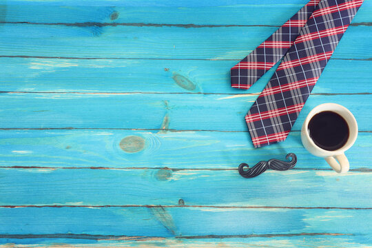 top view image of fathers day composition with vintage father's accessories over blue background