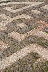 Road pavement made of tiles and cobblestones