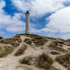 Fototapeta na wymiar view of sand dunes on the Jutland coast of Denmark with the Lyngvid Fyr lighthouse