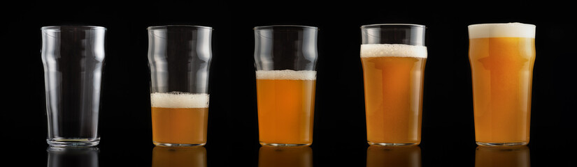 Varying degrees of fullness of glass with beer with foam, from empty to full