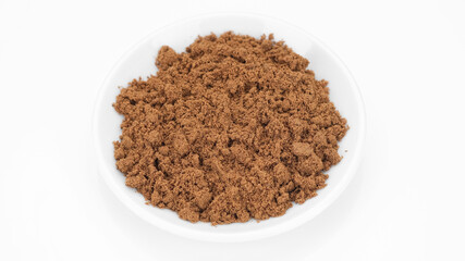 ground nutmeg spice isolated on white background