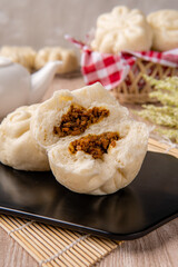 Baozi or Bakpao is a type of yeast-leavened filled bun in various Chinese cuisines. There are many variations in fillings (meat or vegetarian) and preparations, though the buns are most often steamed.