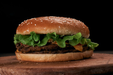 close-up. delicious hamburger on a wooden board.