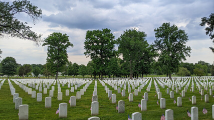 Fototapeta na wymiar Small American flags mark every grave during Memorial Day weekend at Arlington National Cemetery, Arlington, VA.