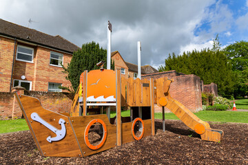 Public children's play equipment that is in the form of a pirate ship