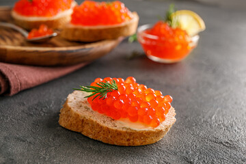 Delicious snack sandwiches with red caviar